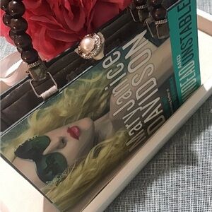 This is Unique upcycle pursed made of a book cover.Brand New Has handles.see pic